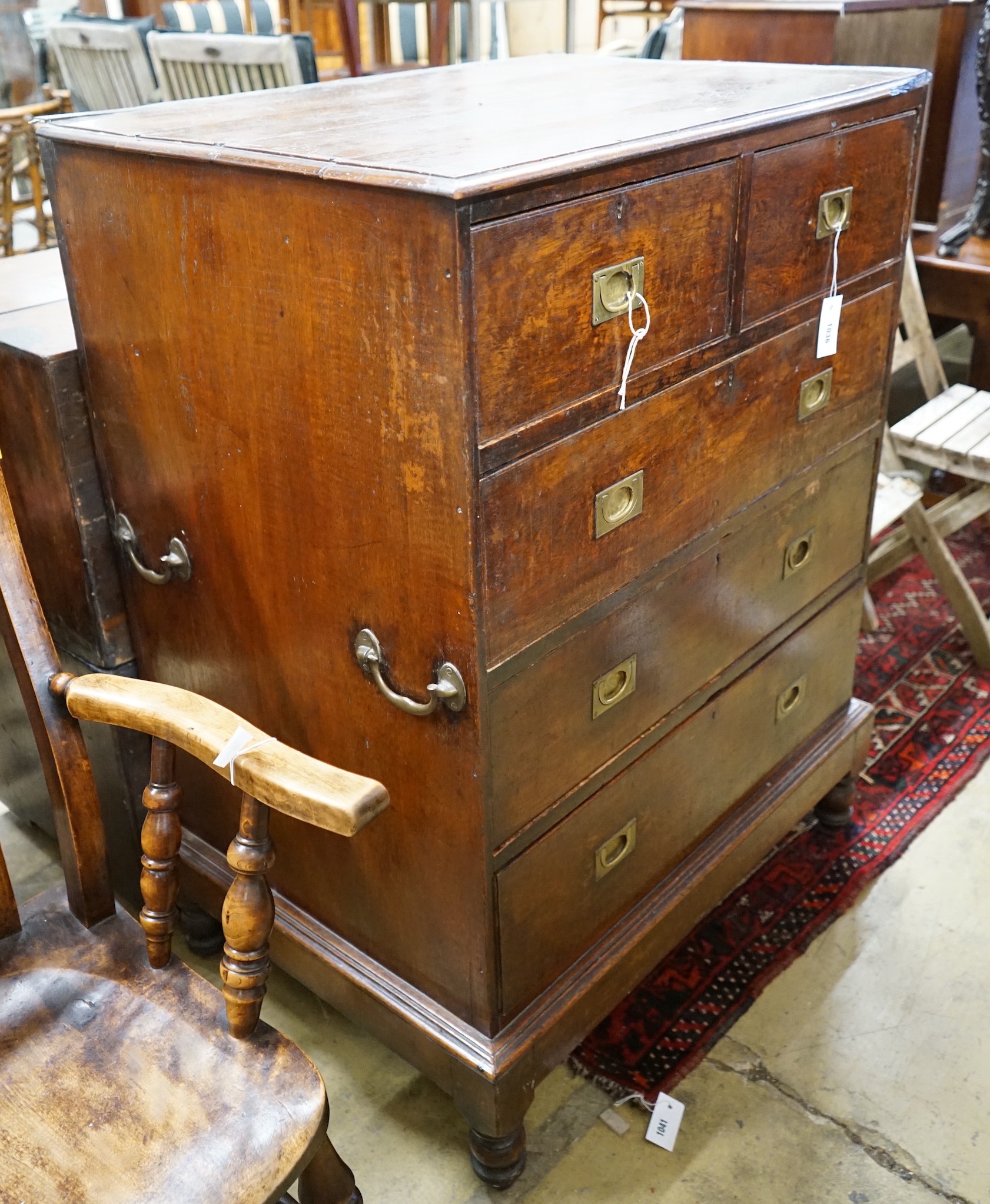 An early 19th century teak military chest with twin brass side handles, width 89cm, depth 62cm, height 117cm